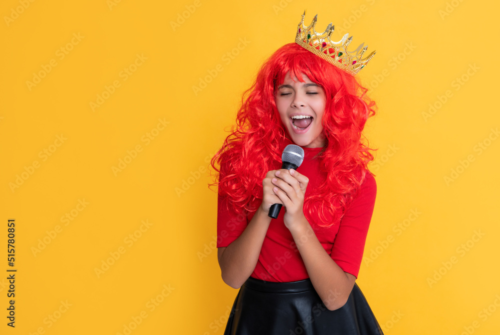 kid smile in crown with microphone on yellow background kid smile in crown with microphone on yellow background