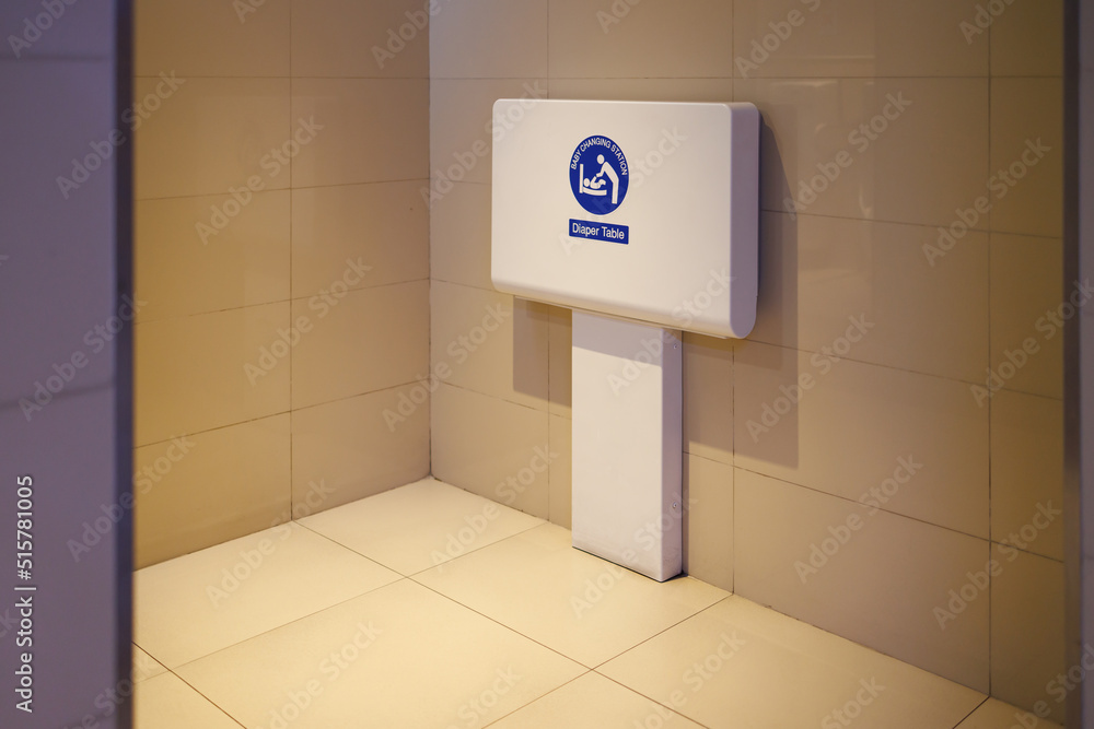 baby changing station in public toilet room. foldable diaper table
