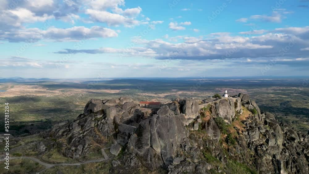 Flying a drone over the mountains, view of the castle ruins, sunny weather, Monsanto, Portugal Flying a drone over the mountains, view of the castle ruins, sunny weather, Monsanto, Portugal
