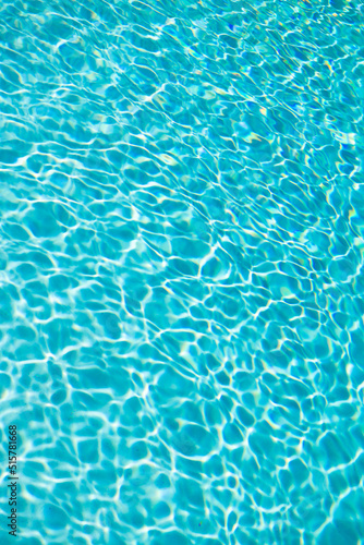 blue swimming pool water background with ripples. summer resort