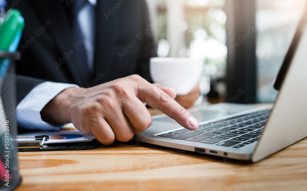 Select focus on hand, businessman use finger touching on enter button on computer keyboard to confirm the business agreement through an online meeting with our business group Select focus on hand, businessman use finger touching on enter button on computer keyboard to confirm the business agreement through an online meeting with our business group