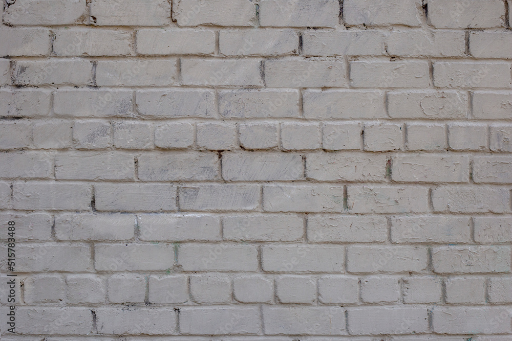 Grey brick wall. Weathered texture stained old paint grey brick wall. Colored brick wall background Grey brick wall. Weathered texture stained old paint grey brick wall. Colored brick wall background