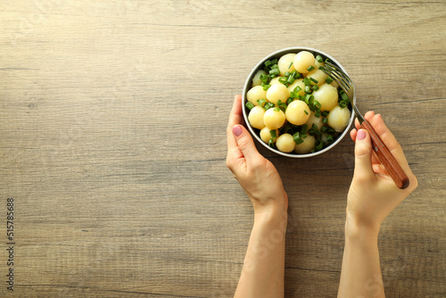 Concept of tasty food with boiled young potatoes, space for text