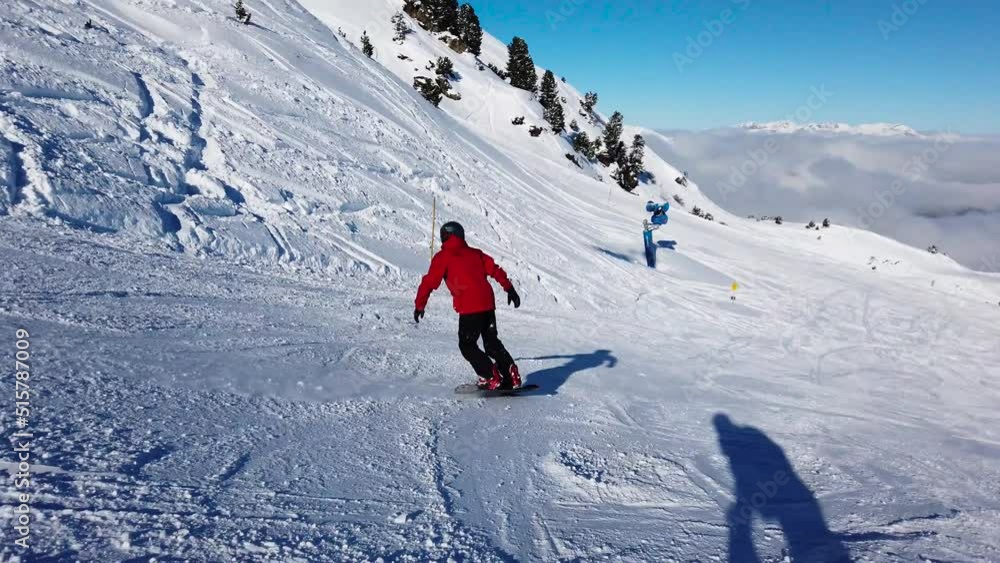 Man snowboarding at mayrhofen Man snowboarding at mayrhofen