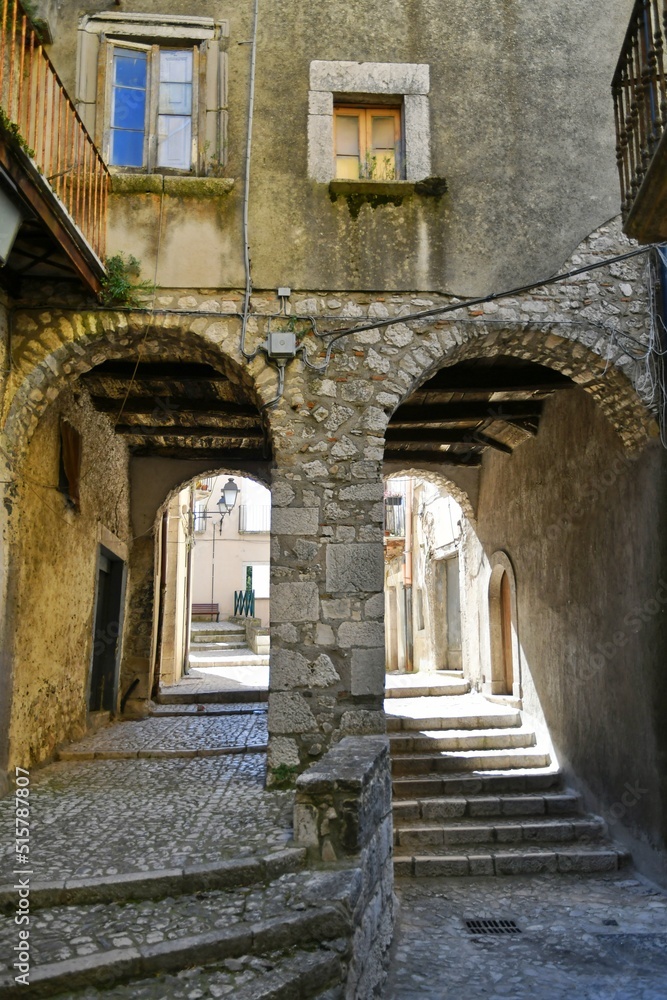 A narrow street between the old houses of Guardia Sanframondi, a village in the province of Benevento, Italy.	

