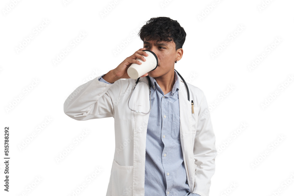 Young peruvian male doctor drinking coffee. Isolated over white background. Young peruvian male doctor drinking coffee. Isolated over white background.
