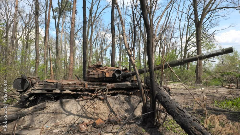 A destroyed and burnt tank of the Russian army as a result of a battle with Ukrainian troops near Kyiv, Ukraine A destroyed and burnt tank of the Russian army as a result of a battle with Ukrainian troops near Kyiv, Ukraine