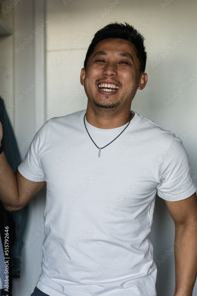 candid man getting dressed at home candid man getting dressed at home
