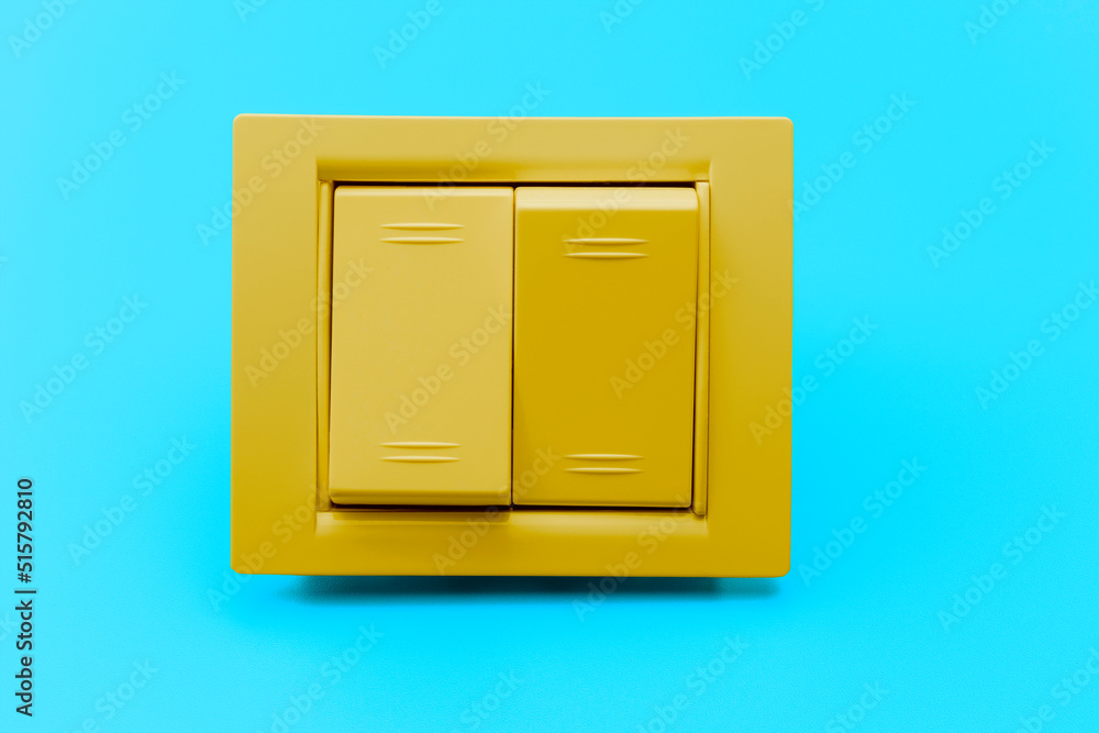 Two-button yellow switch on a blue background. Home electricalian for repair. energy saving concept. close-up. full focus. copyspace. Two-button yellow switch on a blue background. Home electricalian for repair. energy saving concept. close-up. full focus. copyspace.