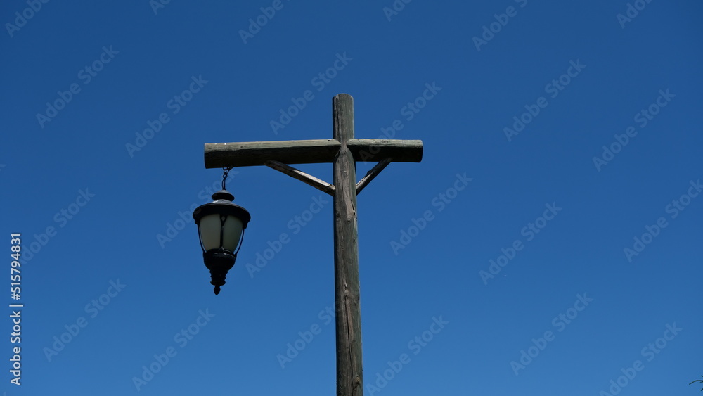 Street lamp. Street lamp with wooden pole. Background sky. Street lamp. Street lamp with wooden pole. Background sky.