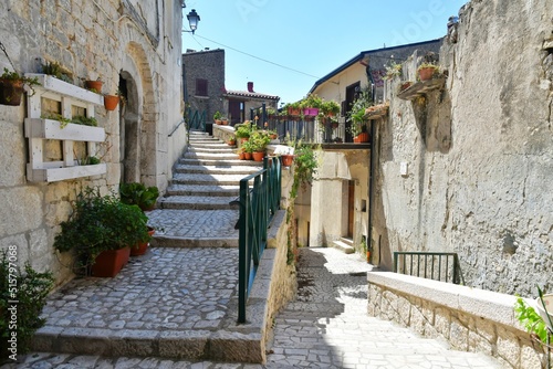 A narrow street between the old houses of Guardia Sanframondi, a village in the province of Benevento, Italy.	
 photo