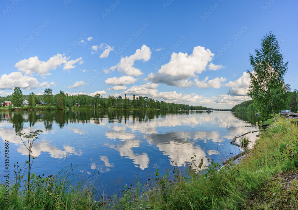 Long Exposure of Magnificent Soft and colorful sunnyday by the river. Beautiful cloud movement water reflection