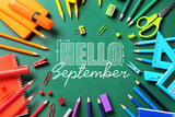 Frame made of school stationery and text HELLO SEPTEMBER on blackboard