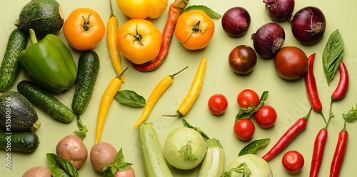 Assortment of fresh vegetables on light green background