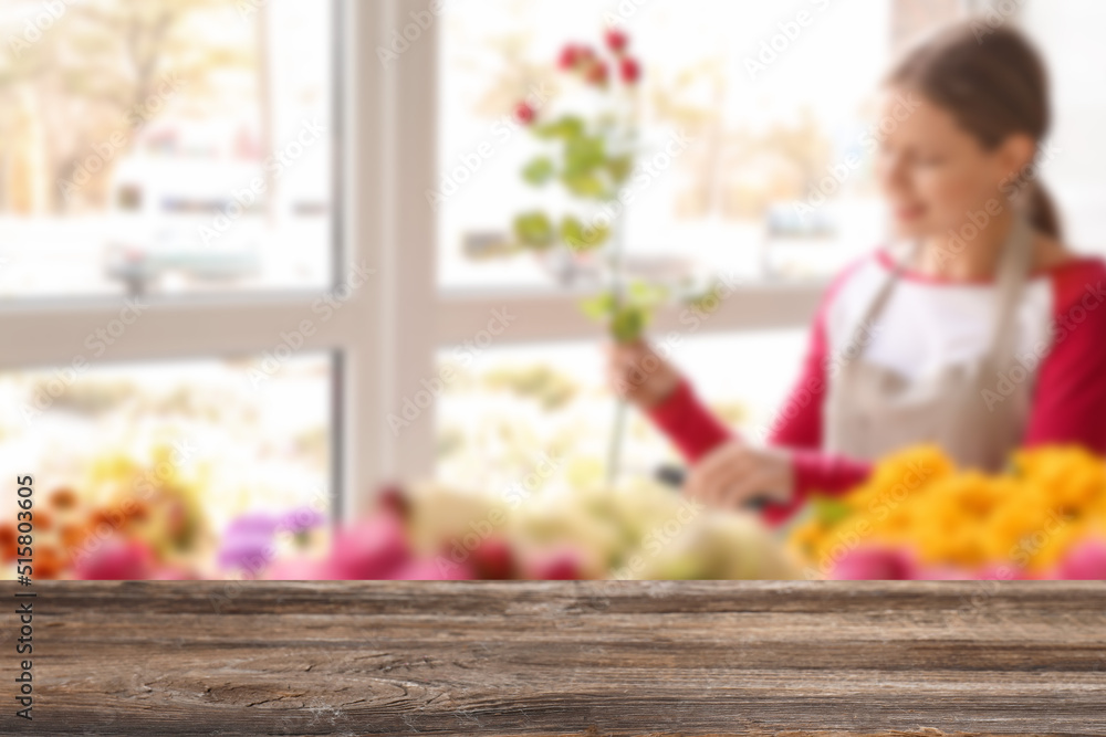 Empty wooden table in flower shop