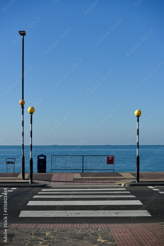 Road crossing leading to the promenade and Southsea beach in Portsmouth, England. 