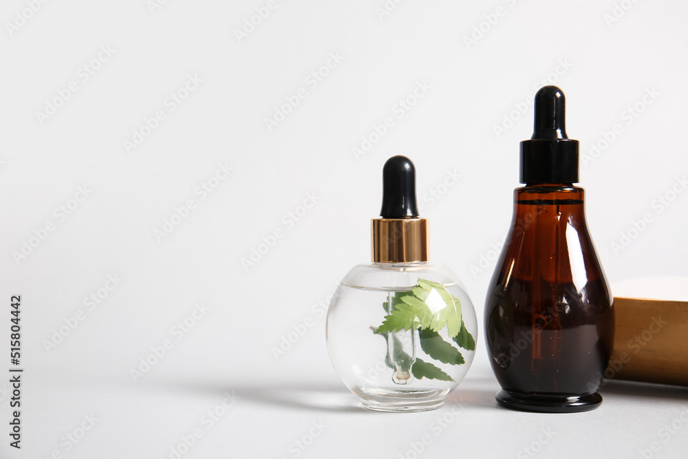 Two bottles of natural serum on white background Two bottles of natural serum on white background