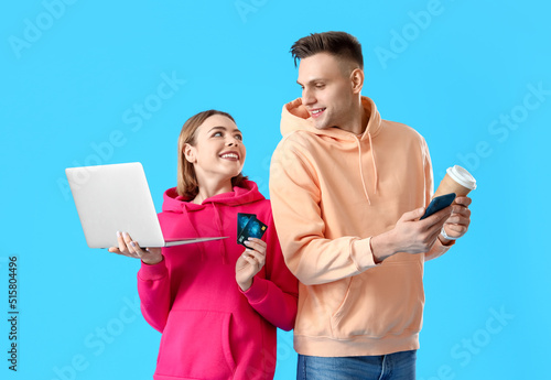 Young couple with laptop, c...