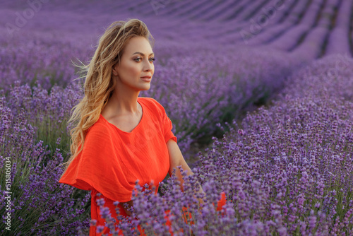 Young beautiful blonde woman in lavender field