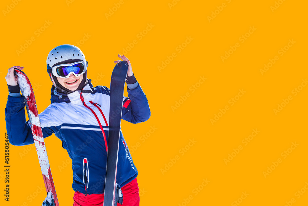 woman with skis on an orange background woman with skis on an orange background