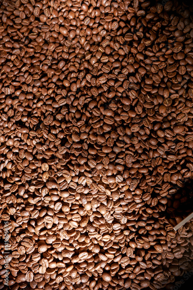 Top view of roasted coffee beans mixing in mixer Top view of roasted coffee beans mixing in mixer