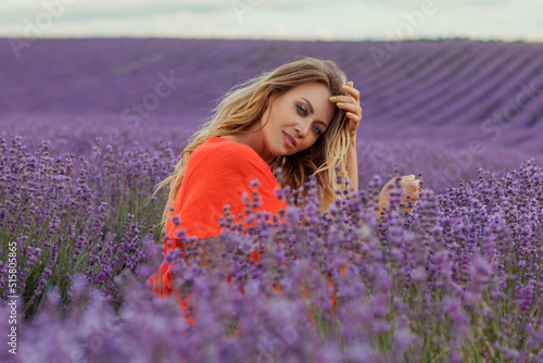 Young beautiful blonde woman in lavender field