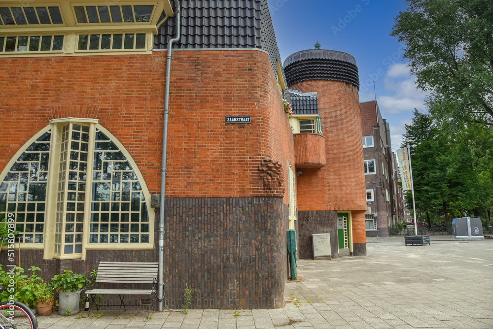 Amsterdam, Netherlands. June 2022. View of characteristic brick residential building in the style of the Amsterdam School in Spaarndammerbuurt, Amsterdam.