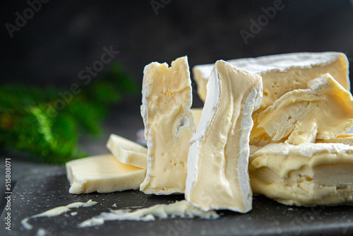 Coulommiers charactere, camembert and brie cheese fresh healthy meal food snack diet on the table copy space food background rustic