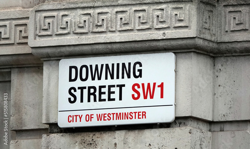 Downing Street sign on a wall in London, UK.  photo