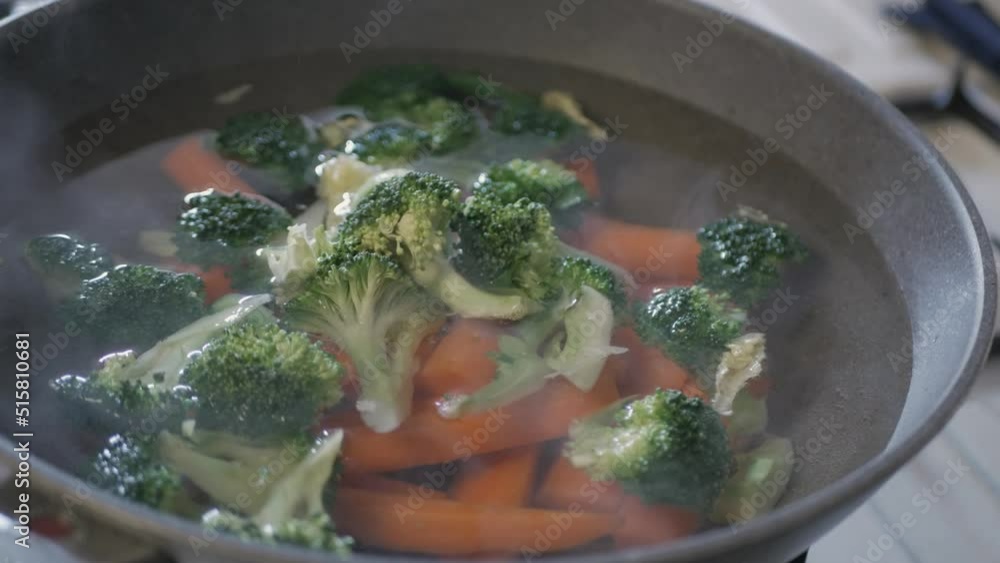 carrot and broccoli was boiled in water in the pan. Healthy boil vegetable carrot and broccoli was boiled in water in the pan. Healthy boil vegetable