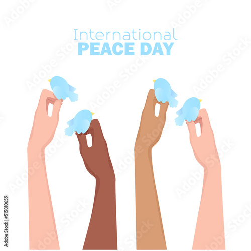International peace day Women's hands of different skin colors hold blue doves