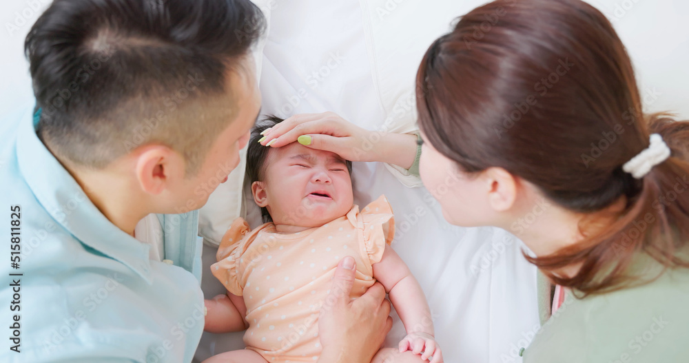 parents comfort crying baby