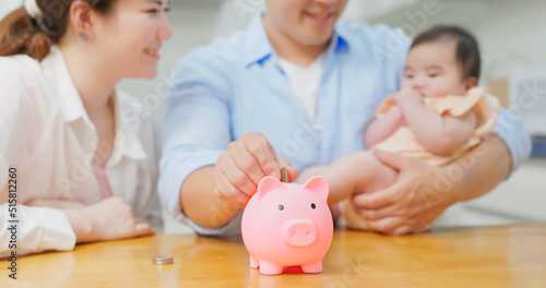 Принти на полотні parents put coin in piggybank