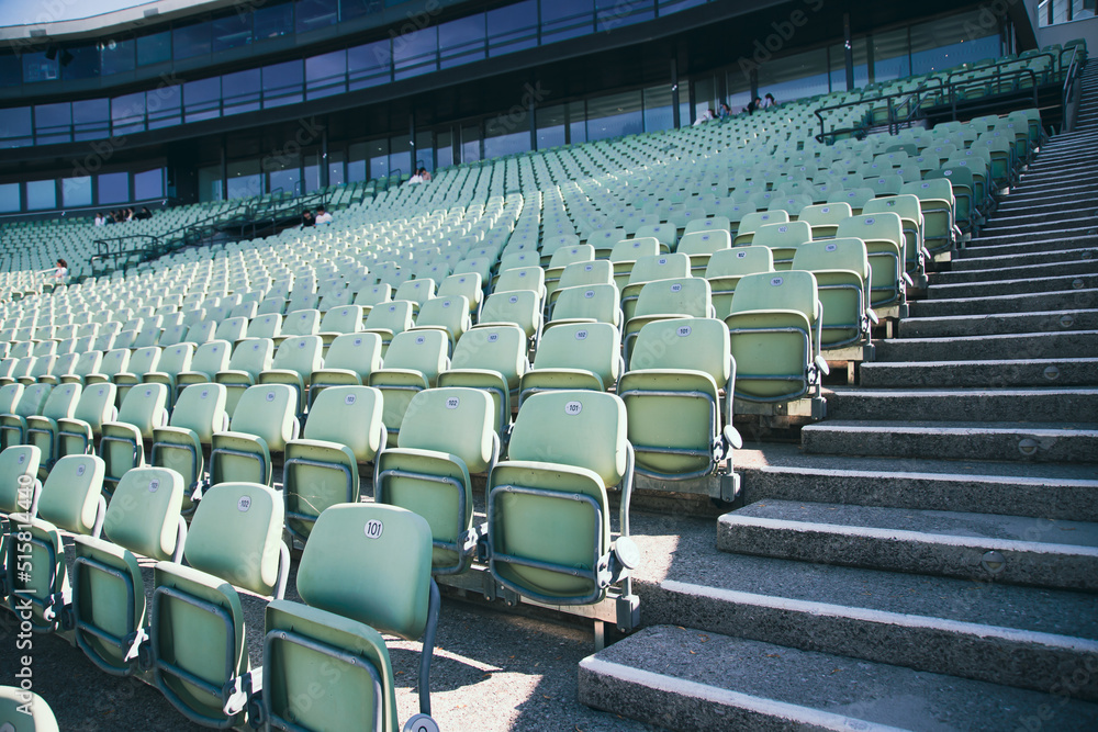 Obraz premium Empty Plastic Chairs at the Stadium