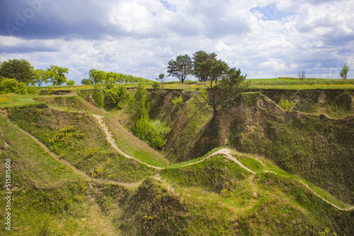 Hills slopes overgrown with green grass  nature reserve Ukrainian Iceland  near Vasylkiv  Ukraine