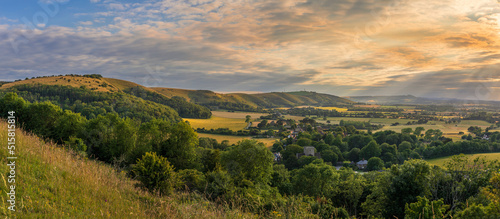 Beautiful views west over the village of Poynings from Devils Dyke to Chanctonbury ring on the south downs in west Sussex south east England UK © SuxxesPhoto