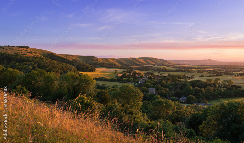 Beautiful views west over the village of Poynings from Devils Dyke to Chanctonbury ring on the south downs in west Sussex south east England UK