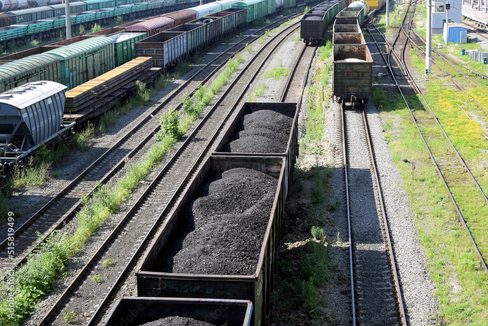 Russia, Chelyabinsk, July 08, 2022: Freight wagons with coal at the railway station. Sending wagons for export.