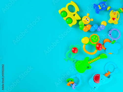 Children s toys rattles on a light blue background. Top view  flat position. The concept of child development. Place for text.