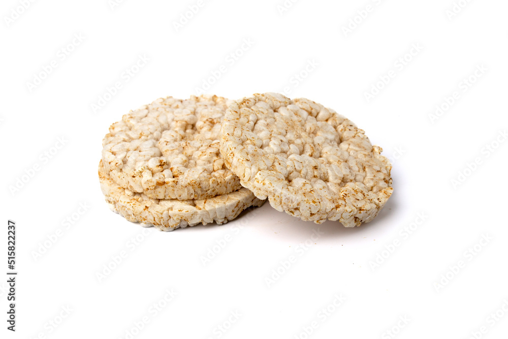 Pile of three healthy puffed rice cakes isolated on white background Pile of three healthy puffed rice cakes isolated on white background