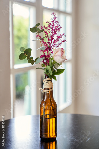 decoration with flowers in a beer bottle