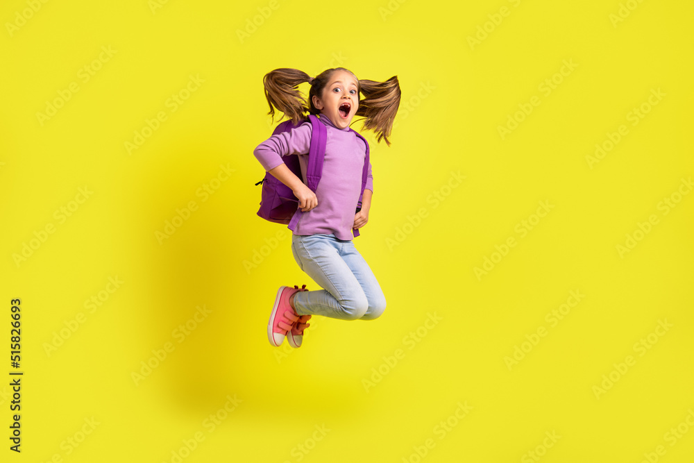 Full length photo of amazed schoolchild jump high enjoy bags discount bargain isolated shine color background Full length photo of amazed schoolchild jump high enjoy bags discount bargain isolated shine color background