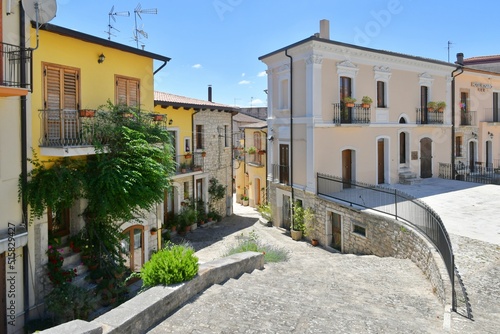 A narrow street between the old houses of Pietrelcina a village in the province of Benevento, Italy. 