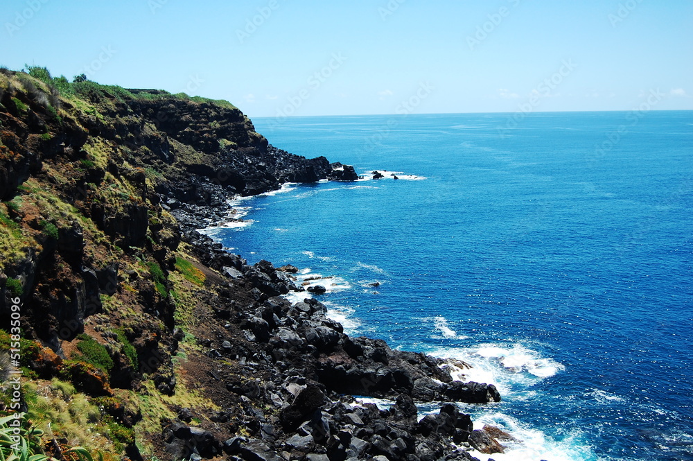 Rocky Azores coast with blue sea and clear sky