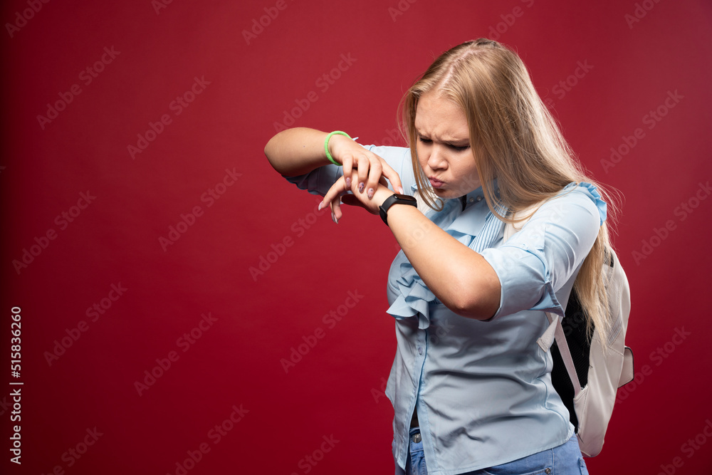 Young blonde schoolgirl goes back to school, checks the time and gets stressed as she is late Young blonde schoolgirl goes back to school, checks the time and gets stressed as she is late