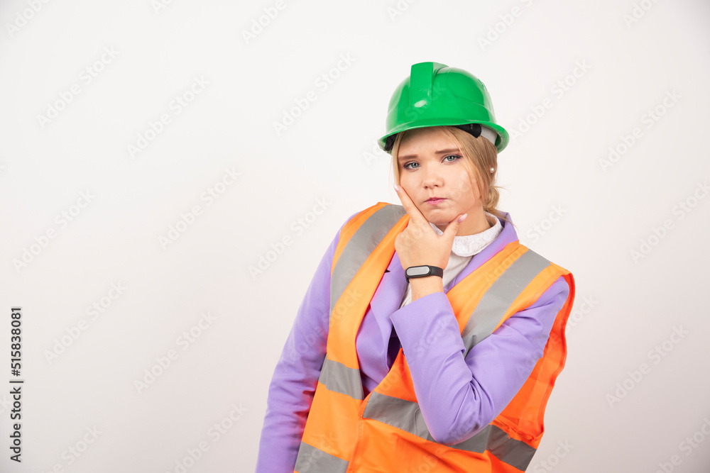 Woman builder in helmet on white background Woman builder in helmet on white background