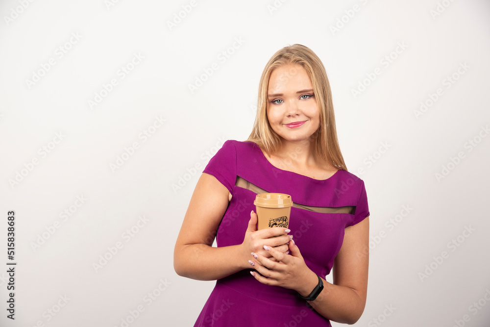 Elegant woman with cup of coffee posing Elegant woman with cup of coffee posing