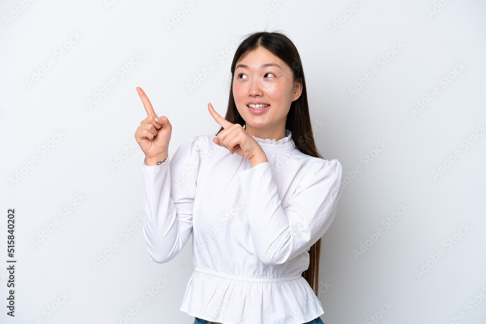 Young Chinese woman isolated on white background pointing with the index finger a great idea Young Chinese woman isolated on white background pointing with the index finger a great idea