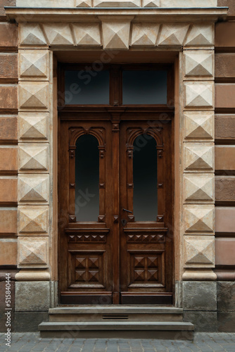 View of building with vintage wooden door. Exterior design