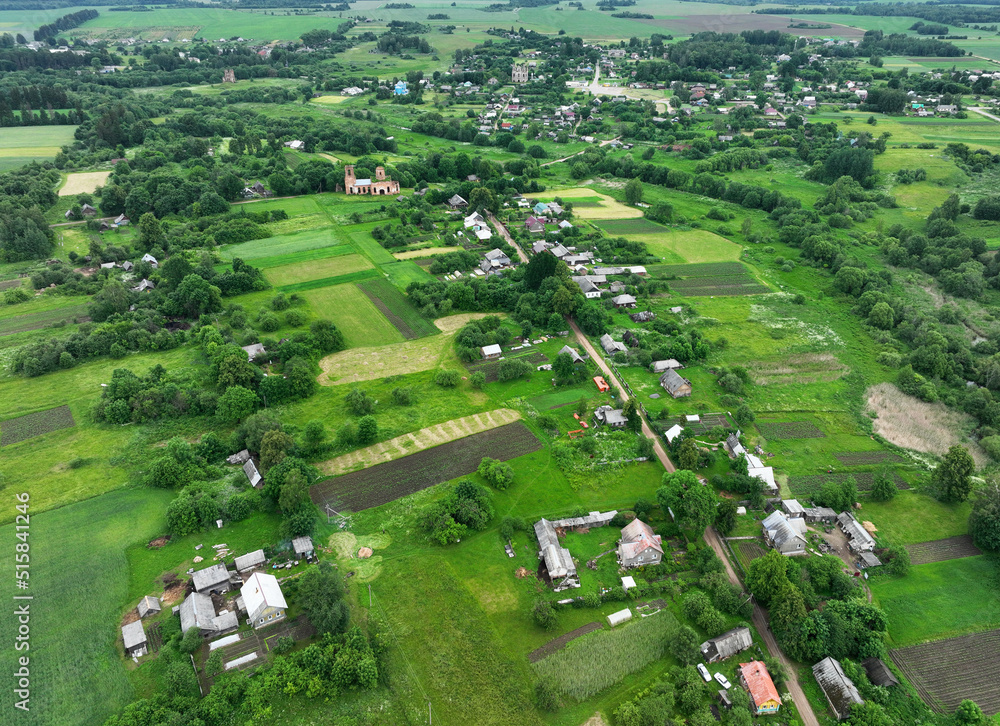 Village wooden house. Country houses in countryside, aerial view. Rural building and farmhouse in countryside. Сountry House. Suburban house in rural. Roofs of village home. Agricultural development.